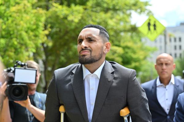 Nick Kyrgios arrives on crutches to the magistrate's court in Canberra on Feb. 3, 2023.