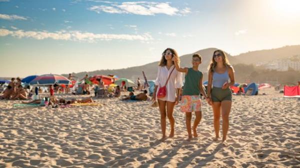 Summer tourism at Praia da California in Sesimbra, Portugal