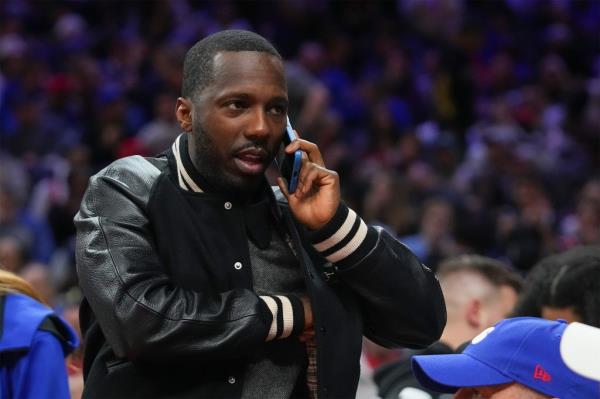 Agent Rich Paul makes a call during a game between the Bulls and 76ers in 2022.