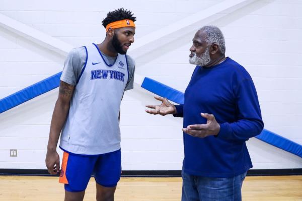 Knicks legend Willis Reed (right) works with Mitchell Robinson at practice on March 21, 2019.