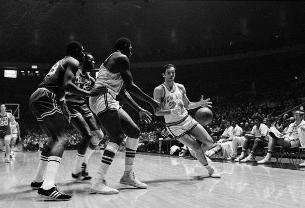 Willis Reed gets off pass to teammate Bill Bradley (24) in first period of game between Knicks and Boston Celtics at New York's Madison Square Garden, Jan. 3, 1970