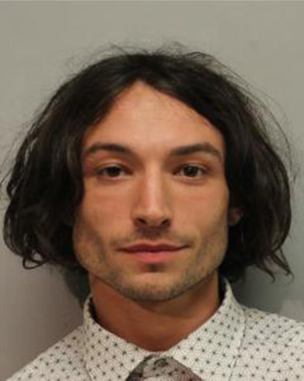Ezra Miller is seen in a police booking photo after his arrest for disorderly co<em></em>nduct and harassment on March 28, 2022 in Hilo, Hawaii.