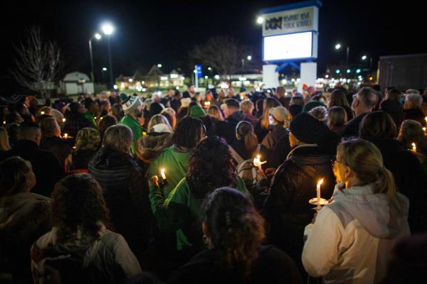 Residents of Newport News hold a candlelight vigil in ho<em></em>nor of Richneck Elementary School first-grade teacher Abby Zwerner at the School Administration Building in Newport News, Va., Monday, Jan. 9, 2023. 