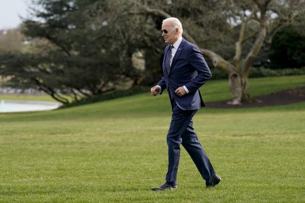 President Joe Biden jogs across the South Lawn of the White House to speak with visitors before boarding Marine One, Friday, March 18, 2022, in Washington. Biden turned 80 on Sunday, Nov. 20.