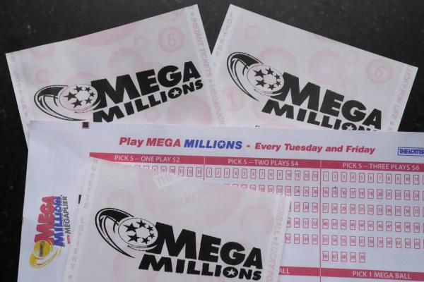 Mega Millions lottery tickets and a wager slip are displayed, Friday, Jan. 6, 2023, in Derry, N.H. 