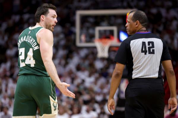 Pat Co<em></em>nnaughton addresses Eric Lewis during a Milwaukee Bucks game against the Miami Heat in the 2023 NBA playoffs.