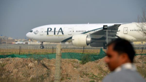 A Pakistan Internatio<em></em>nal Airline plane taxis on the runway in Islamabad.Photographer: Farooq Naeem/AFP/Getty Images