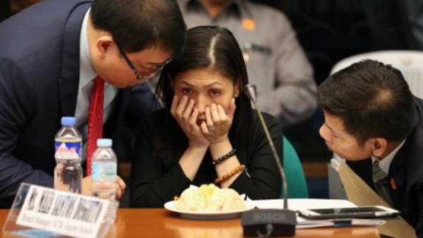 Rizal Commercial Banking Corporation Branch Manager Maia Santos Deguito receives advice from her lawyers during the Senate hearing on March 15. Photographer: Mark R. Cristino/EPA