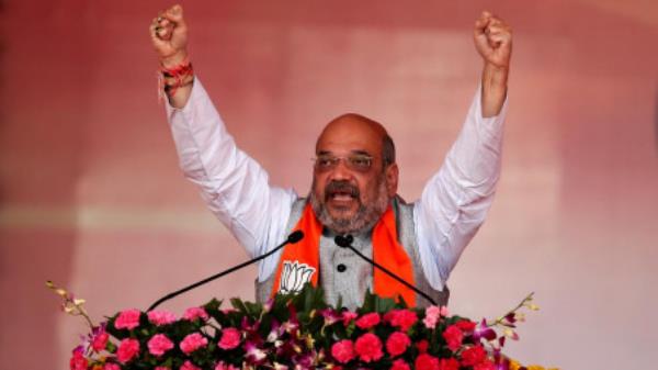 Amit Shah, President of India's ruling Bharatiya Janata Party (BJP), addresses supporters during a public rally at Bhaat village on the outskirts of Ahmedabad, India October 16, 2017/ Reuters