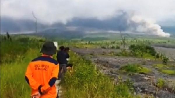 People look on as volcanic ash fills the sky during an eruption of the Semeru volcano in Lumajang, East Java Province, Indo<em></em>nesia December 4, 2022 in this screen grab obtained from a social media video. Instagram/@Gustiallah Foundation/via REUTERS