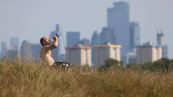 A man drinks from a bottle at Primrose Hill, in London, Britain, September 3, 2023. File photo from REUTERS