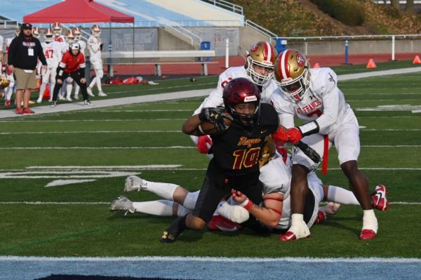 Cardinal player diving for a touchdown