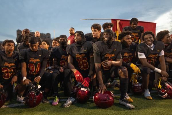 Cardinal Hayes Cardinals players on the field after their win