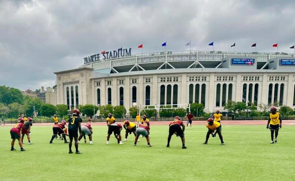 Cardinal Hayes Football team practice with Yankee Stadium in background