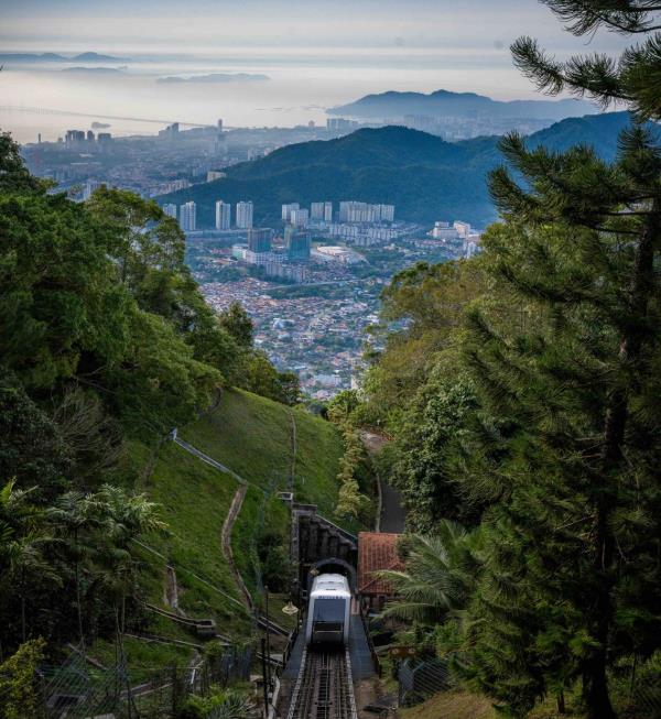 The third-generation funicular train emerging from the railway's ico<em></em>nic tunnel, which is one of the steepest of its kind in the world. Photo: David S.T. Loh 