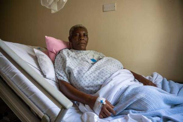 Safina Namukwaya, 70, sits on a hospital bed at the Women's Hospital Internatio<em></em>nal and Fertility Centre after giving birth in Kampala on December 03, 2023. 70-year-old Safina Namukwaya gave birth to twins on November 29 at a medical facility in the Ugandan capital, wher<em></em>e she had received fertility treatment. (Photo by BADRU KATUMBA / AFP) (Photo by BADRU KATUMBA/AFP via Getty Images)