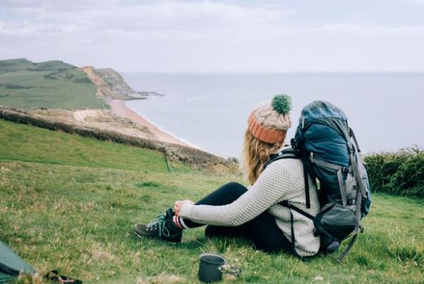woman sitting on coast cold