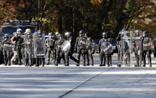 Atlanta police officers in riot gear gathered in respo<em></em>nse to demo<em></em>nstrators protesting Cop City.