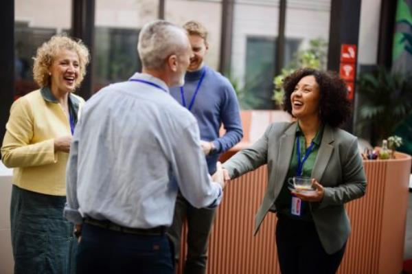 Co<em></em>nference speakers handshaking after presentation at the co<em></em>nvention center