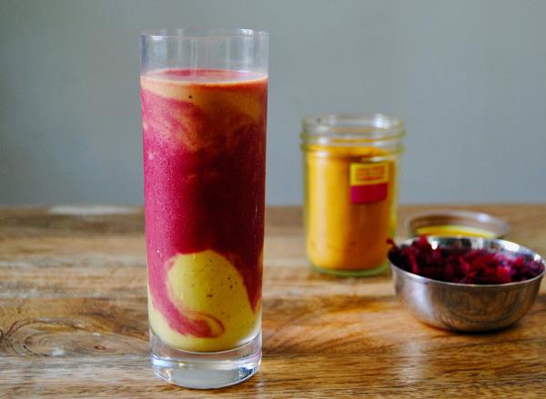 paleo fruit smoothie in glass on wooden surface