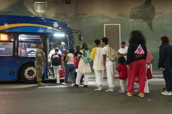 Mayor Adams announced that two new migrant shelters will open in New York City. Migrants, pictured above, leave the Port Authority Bus Terminal for a city run processing center on May 13, 2023.