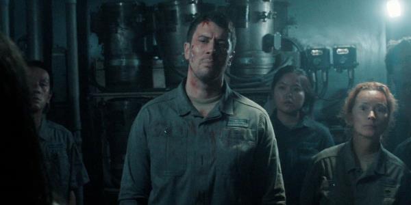 A battered and bloody Miles surrounded by his fellow workers in For All Mankind season 4