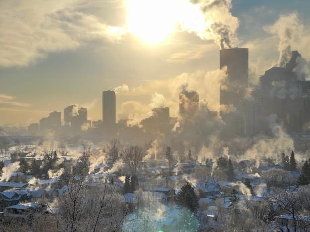Calgary houses and highrises are shown on a bitterly cold winter day.