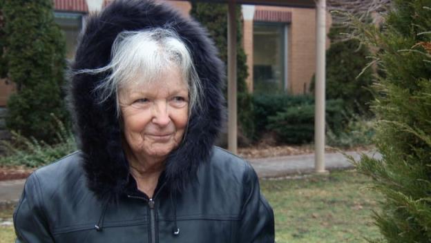 A woman in a black jacket.