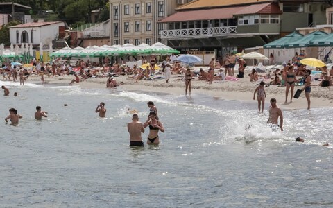 People relax at a Black Sea beach that was reopened after being closed down last year following sea mines laid around the ports of Odesa and Mykolaiv by Russia and Ukraine, amid Russia's attack on Ukraine, in Odesa, Ukraine August 10, 2023. 