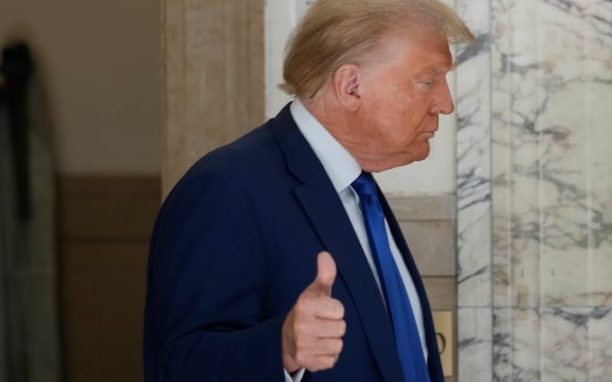 Former President Do<em></em>nald Trump motions as he returns to the courtroom during a break in his civil business fraud trial at New York Supreme Court, Wednesday, Oct. 25, 