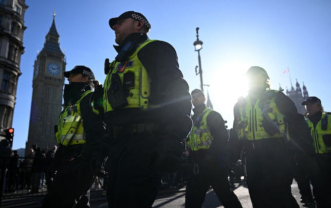 Police officers make their way down Whitehall in central Lo<em></em>ndon on November 11, 2023
