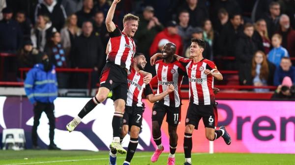 Nathan Collins celebrates scoring the winner with team-mates Neal Maupay, Yoane Wissa and Christian Norgaard