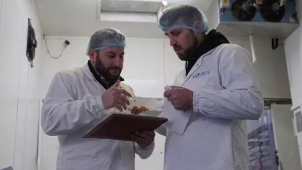 Mohammed Cherbatji, left, runs a meat business with his brother 