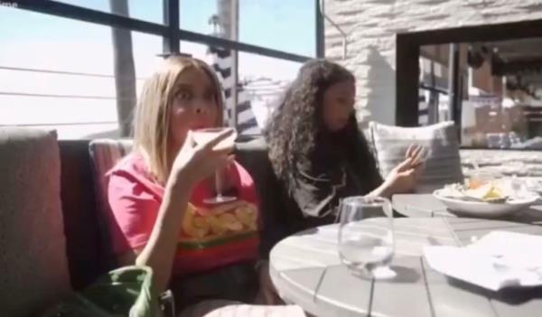 Wendy Williams sipping a drink. 
