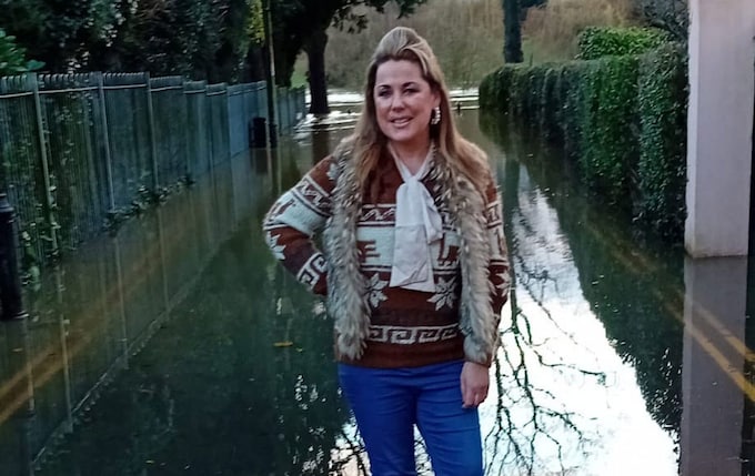 Siobhan Co<em></em>nnor stands ankle-deep in floodwater in Shrewsbury, Shropshire 