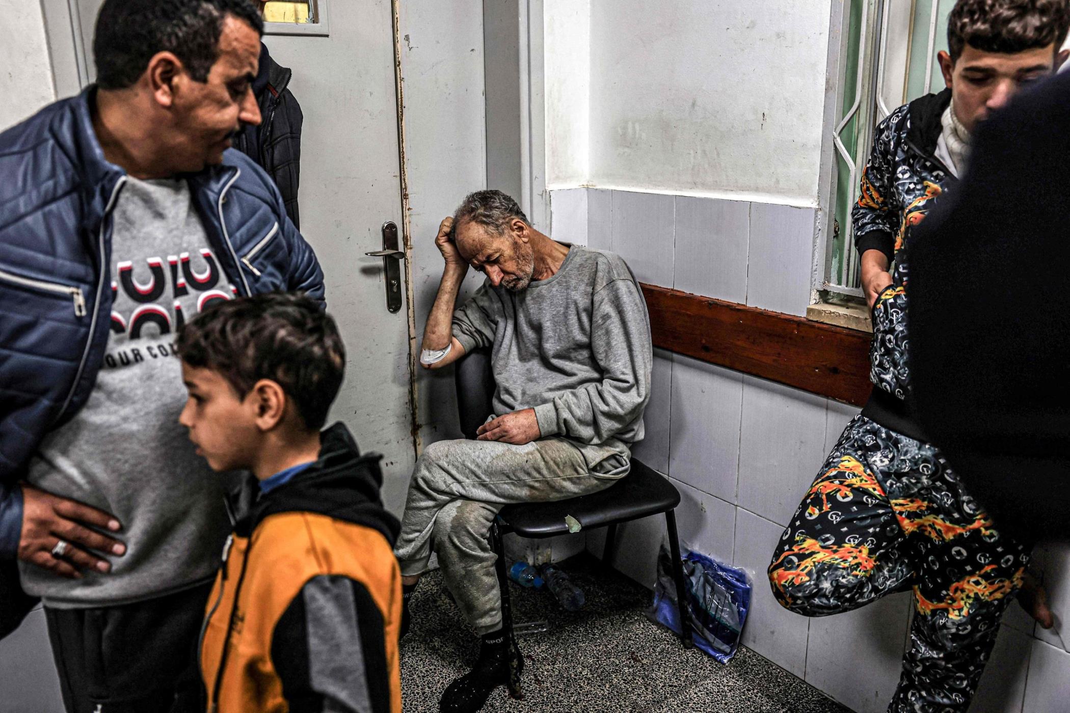 A man, who was detained with other Palestinians by the Israeli military during their operation in the northern Gaza Strip and recently released through the Kerem Shalom crossing, reacts as he awaits treatment for his injuries at al-Najjar hospital in Rafah, southern Gaza Strip, Dec. 24, 2023. (AFP Photo)