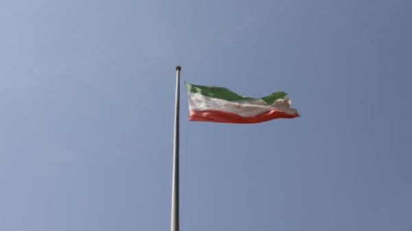 The Iranian flag is seen flying over Evin prison in Tehran, Iran October 17, 2022. Majid Asgaripour/WANA (West Asia News Agency) via REUTERS
