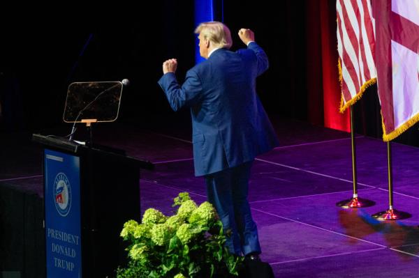 Former US President and 2024 hopeful Do<em></em>nald Trump dances as he leaves after speaking at the Alabama Republican Party's summer dinner in Montgomery, Alabama.