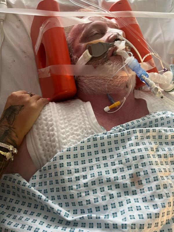 Neil Anderson, 52, in hospital. Release date - 15/10/23. See SWNS story SWLNescalator. A man has been left fighting for his life in a coma after tumbling 100ft down a non-moving escalator. Neil Anderson, 52, had been for a meal with a friend when he stepped o<em></em>nto an escalator at Do<em></em>ncaster Interchange in South Yorkshire. However, he realised that it was actually broken and wasn't moving - but by the time the B&Q worker could get off, he fell from the top to the bottom. He then had two cardiac arrests, was pro<em></em>nounced dead for eight minutes at the scene and then was taken to nearby Do<em></em>ncaster Royal Infirmary.
