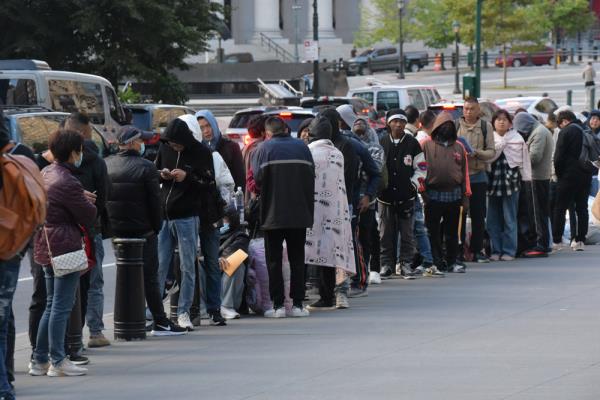 Migrant adults, without children, wait midline at 26 Federal Plaza to apply for federal services, such as a work permit or asylum. 