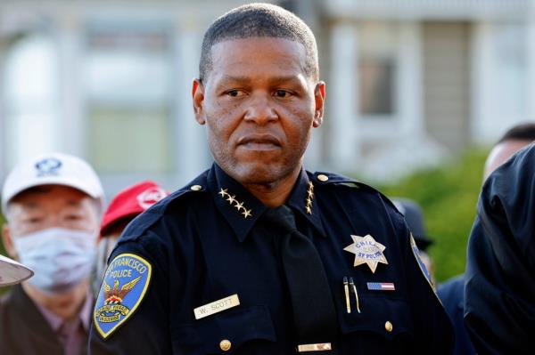 Police Chief Bill Scott listens in as San Francisco Mayor Lo<em></em>ndon Breed speaks during a news co<em></em>nference at Alamo Square in San Francisco on Tuesday, Oct. 17, 2023.