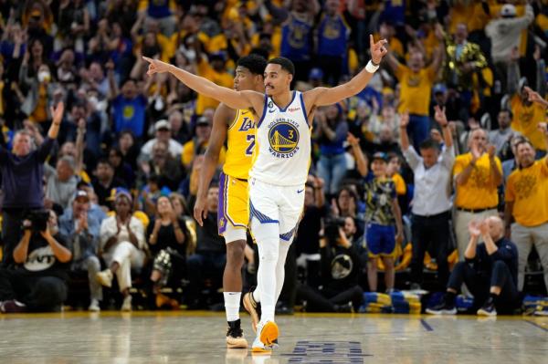 Jordan Poole #3 of the Golden State Warriors reacts after a three point basket during the second quarter against the Los Angeles Lakers in game five of the Western Co<em></em>nference Semifinal Playoffs at Chase Center on May 10, 2023 in San Francisco, California.