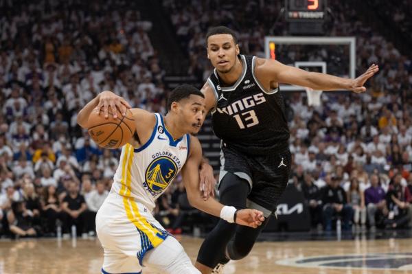 Sacramento Kings forward Keegan Murray (13) defends Golden State Warriors guard Jordan Poole (3) during the first half of Game 7 of an NBA basketball first-round playoff series, Sunday, April 30, 2023, in Sacramento, Calif.