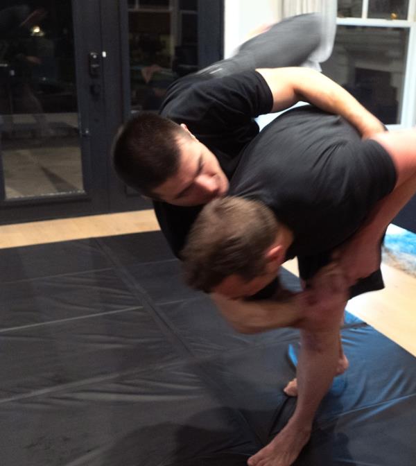 Musk, 51, was seen holding Fridman in a headlock and flipping him o<em></em>nto his back.