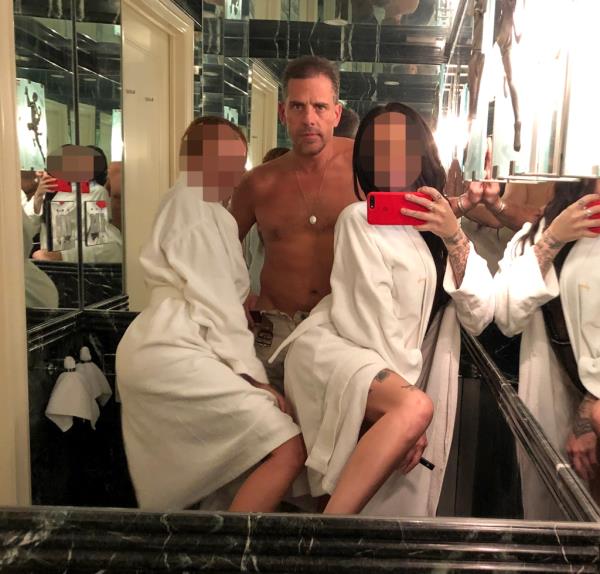 Shirtless Hunter Biden with two women in robes