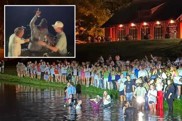 The baptisms took place Tuesday night in a lake at Auburn's Red Barn venue, which is located a<em></em>bout half a mile from Auburn University's Neville Arena