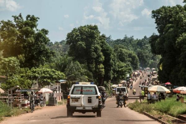 An ambulance carries the remains of an Ebola victim towards a burial site in Mbandaka on May 22, 2018, in the Democratic Republic of Congo. - Health workers fighting Ebola in the Democratic Republic of Co<em></em>ngo have run into an invisible but powerful hurdle -- a belief system that deems the disease to be a curse or the result of evil spirits. Some people are refusing medical care and turn instead to preachers and prayers to chase away the threat, they say. (Photo by Junior D. KANNAH / AFP) (Photo credit should read JUNIOR D. KANNAH/AFP via Getty Images)
