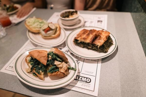 The signature collard greens sandwich ($17) and “Yuba-Verde” — dried tofu skin, chickpeas, broccoli rabe on Italian bread ($21) -- are two of the most ordered items on the menu. 