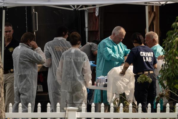 Cops searching alleged killer's home.