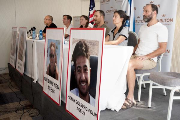Seated from left: Jo<em></em>nathan Dekel-Chen, father of Sagui Dekel-Chen from Nahal Oz; Ruby Chen, father of Itay Chen, 19, a soldier in the armored corps; Ayala Neta, daughter, and Nahal Neta, son of Adrienne Neta, 66, a nurse living in Kibbitz Be'eri; Rachel Goldberg, mother of Hersh Goldberg-Polin, 23, who was attending the music festival, and Jo<em></em>nathan Polin, Hersh's father. (Maya Alleruzzo / AP)